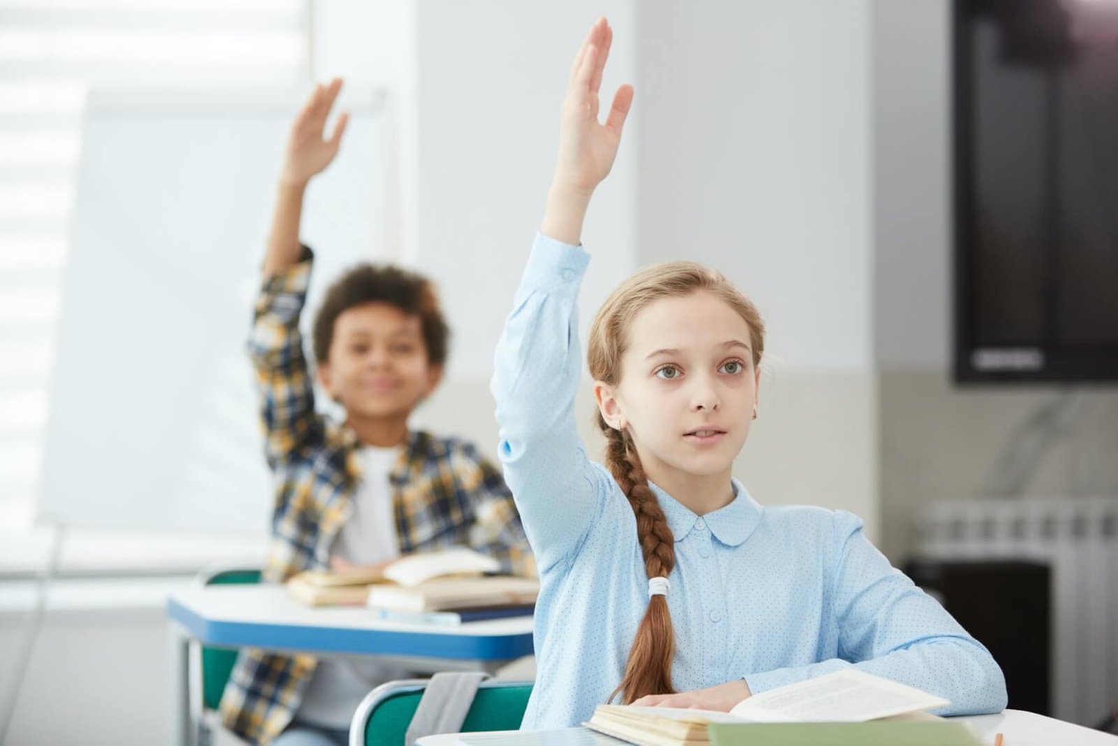 children-raising-hands-in-school.jpg